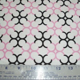 Claire Bella circles in pink and black on white flannel